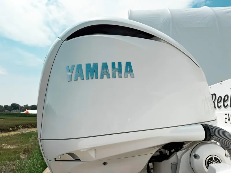 Slide: The Image of Yamaha outboard motor on 2022 Pursuit S 328 Sport boat, side view. - 40