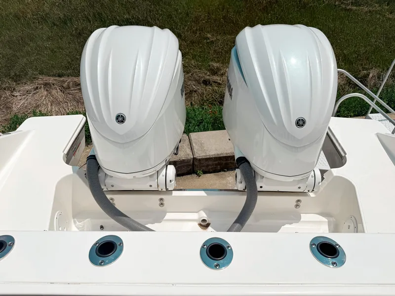 Slide: The Image of 2022 Pursuit S 328 Sport boat with dual outboard engines. - 8