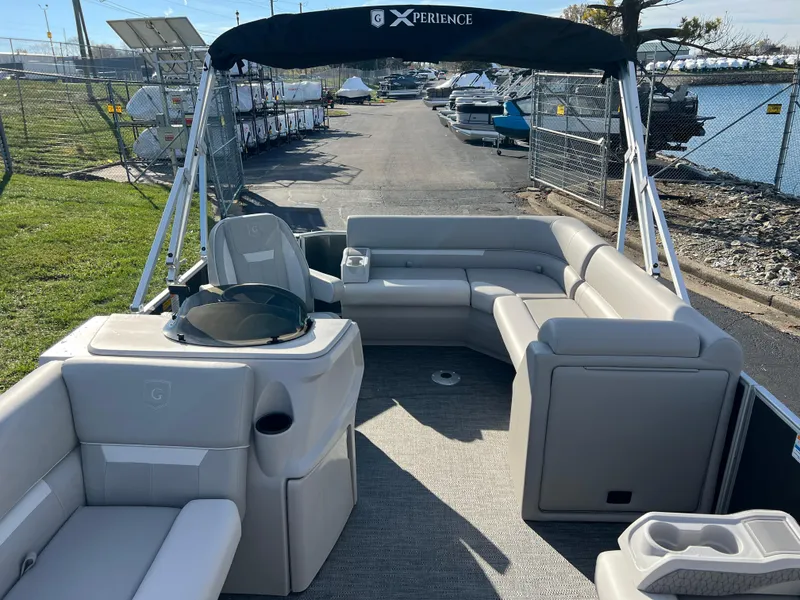 Slide: The Image of 2025 Godfrey Xperience 1880 CX pontoon boat with spacious seating and modern design. - 10