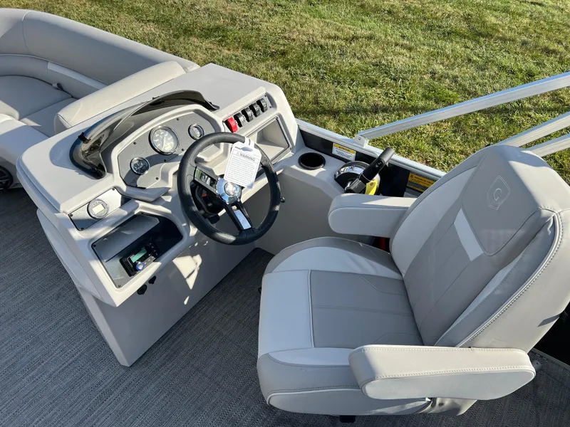 Slide: The Image of 2025 Godfrey Xperience 1880 CX boat interior with steering wheel and seating. - 15