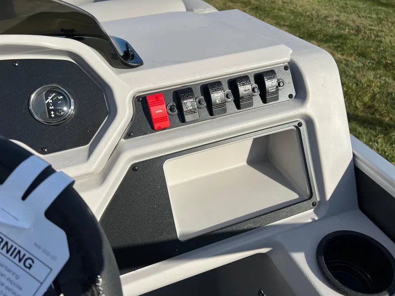 Slide: The Image of 2025 Godfrey Xperience 1880 CX dashboard with switches and storage compartment. - 17