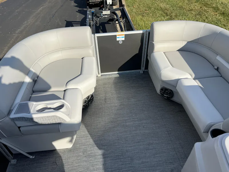 Slide: The Image of 2025 Godfrey Xperience 1880 CX pontoon boat interior with gray seating and carpet. - 19