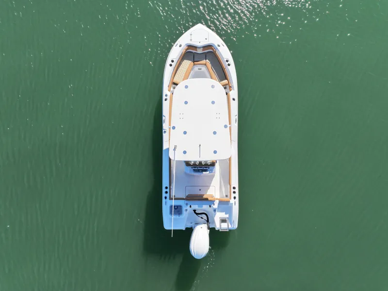 Slide: The Image of Aerial view of 2025 NauticStar 242OS boat on calm water. - 5
