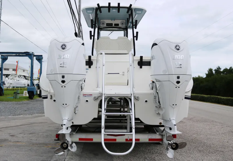 Slide: The Image of 2025 World Cat 295CC boat with dual 300 HP engines, rear view. - 4