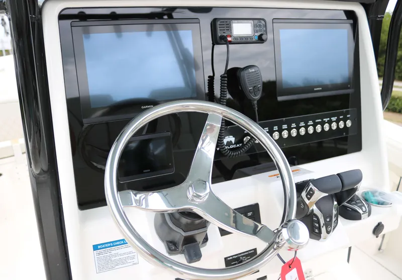 Slide: The Image of 2025 World Cat 295CC helm with dual screens and steering wheel. - 6