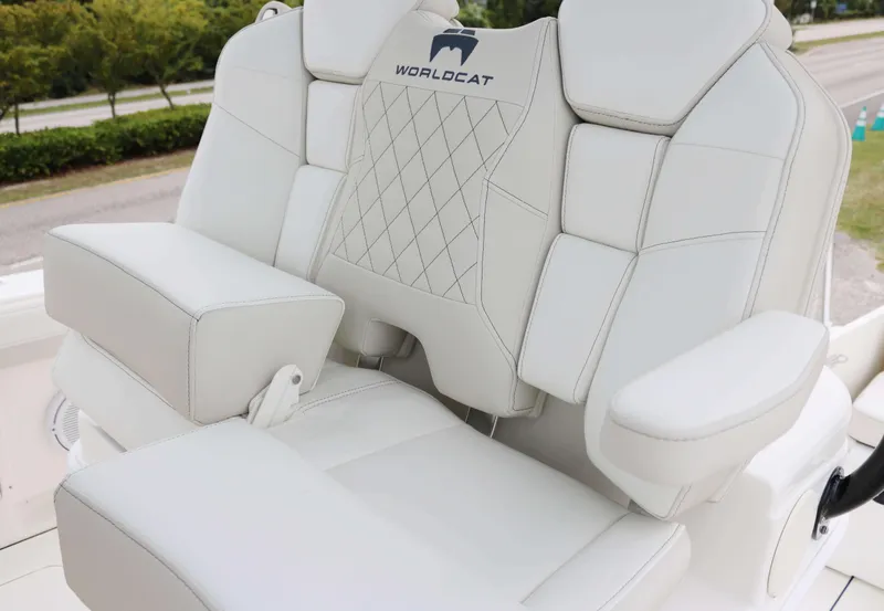 Slide: The Image of Luxurious seating on 2025 World Cat 295CC boat, featuring elegant white upholstery. - 7
