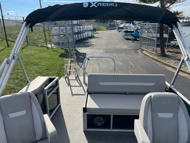 Slide: The Image of 2025 Godfrey XPERIENCE 2286 SFLC pontoon boat interior with seating and canopy. - 10