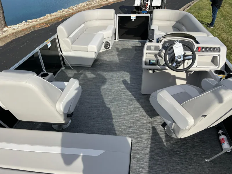 Slide: The Image of 2025 Godfrey XPERIENCE 2286 SFLC pontoon boat interior with modern seating and steering console. - 17