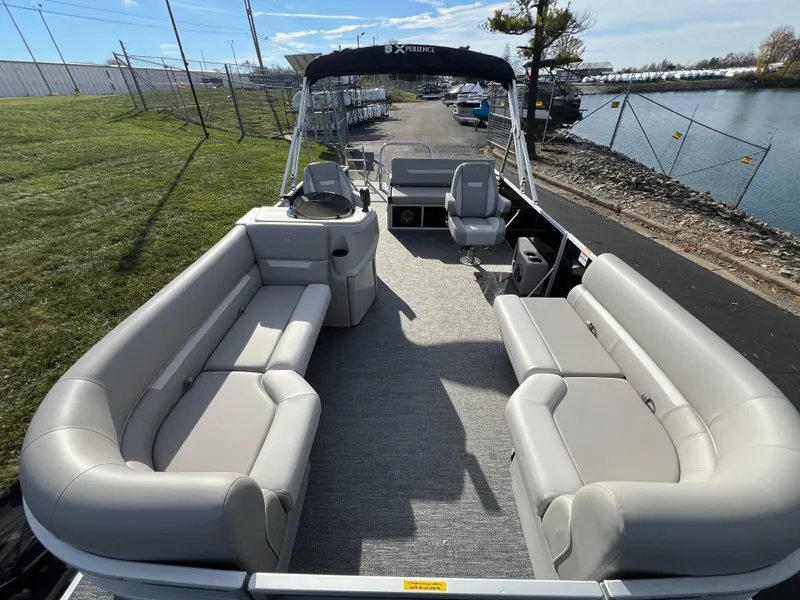 Slide: The Image of 2025 Godfrey XPERIENCE 2286 SFLC pontoon boat with spacious seating and modern design. - 7