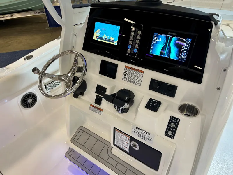 Slide: The Image of 2025 Sea Fox 268 Commander boat dashboard with advanced navigation displays and controls. - 18