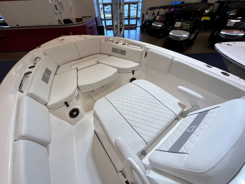 Slide: The Image of 2025 Sea Fox 268 Commander boat interior with white cushioned seating. - 21