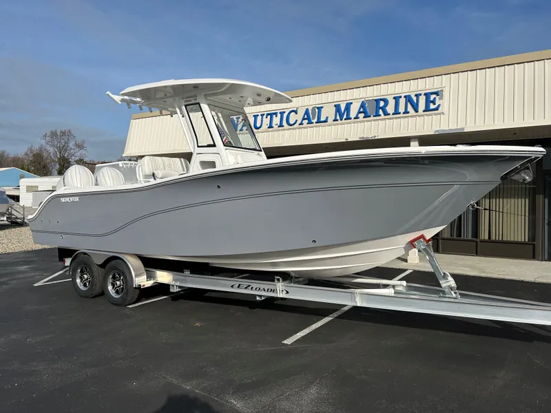 Slide: The Image of 2025 Sea Fox 268 Commander boat on trailer at Nautical Marine dealership. - 4