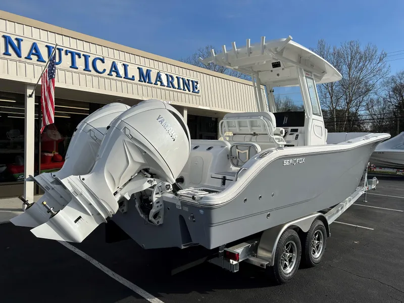 Slide: The Image of 2025 Sea Fox 268 Commander boat with twin engines at Nautical Marine dealership. - 9