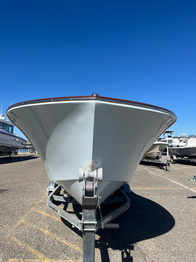 Slide: The Image of 2013 Quiet Waters Boatworks Hill 16 on trailer under clear blue sky. - 3