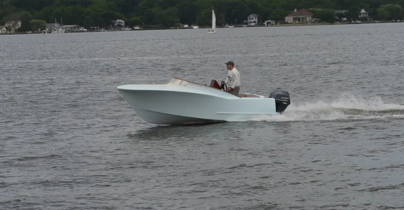 Slide: The Image of 2013 Quiet Waters Boatworks Hill 16 cruising on a lake with a person steering. - 5