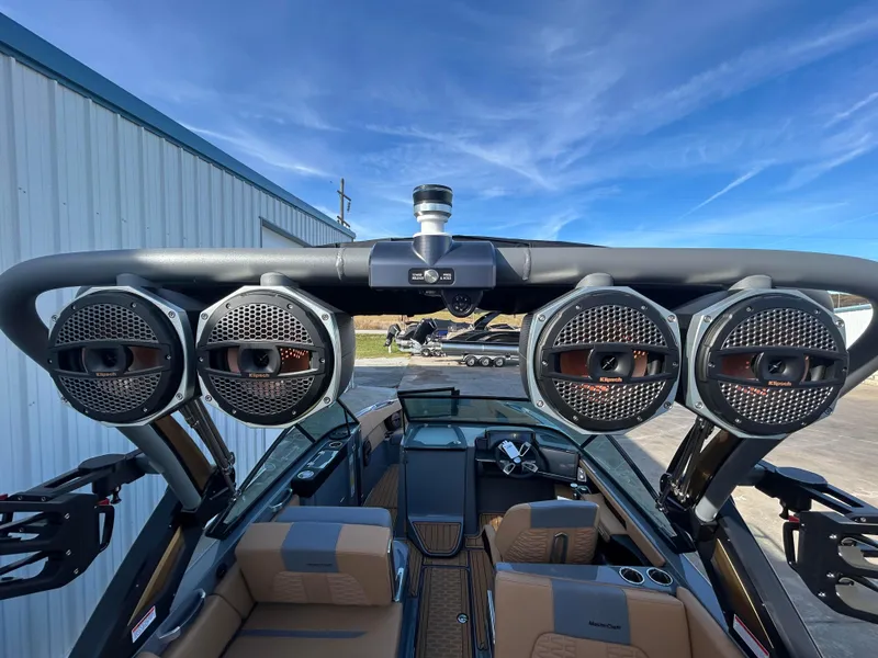 Slide: The Image of 2025 MasterCraft X26 boat interior with advanced audio system and sleek design. - 10
