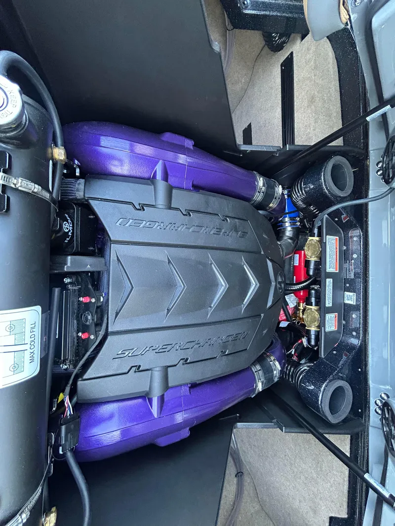 Slide: The Image of 2025 MasterCraft X26 engine with purple components and sleek design. - 8
