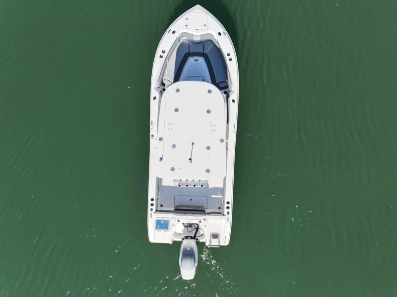 Slide: The Image of Aerial view of 2025 NauticStar 242OS boat on green water. - 9