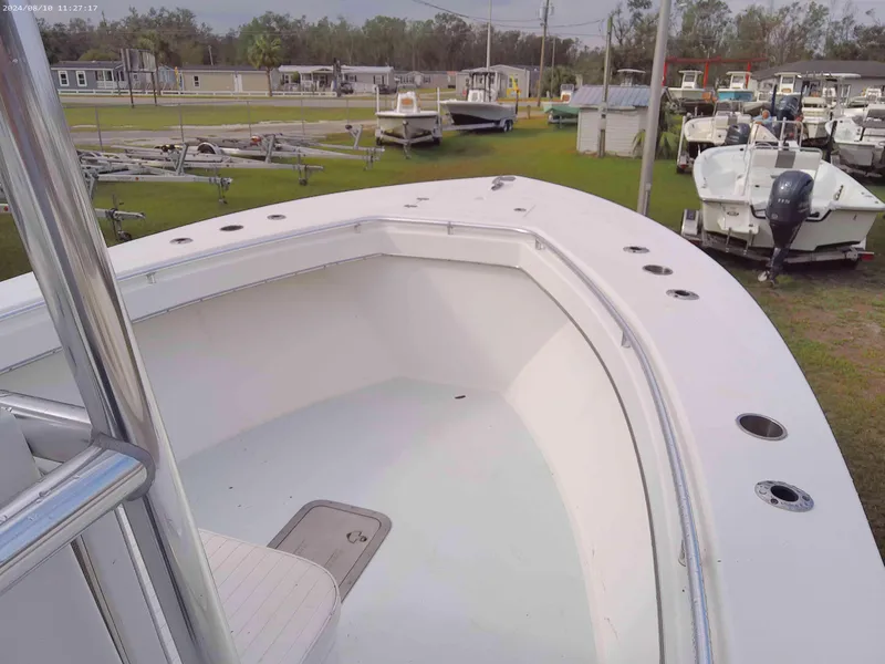 Slide: The Image of 2019 Jones Brothers 26 Cape Fisherman boat, white deck, docked in a marina. - 4
