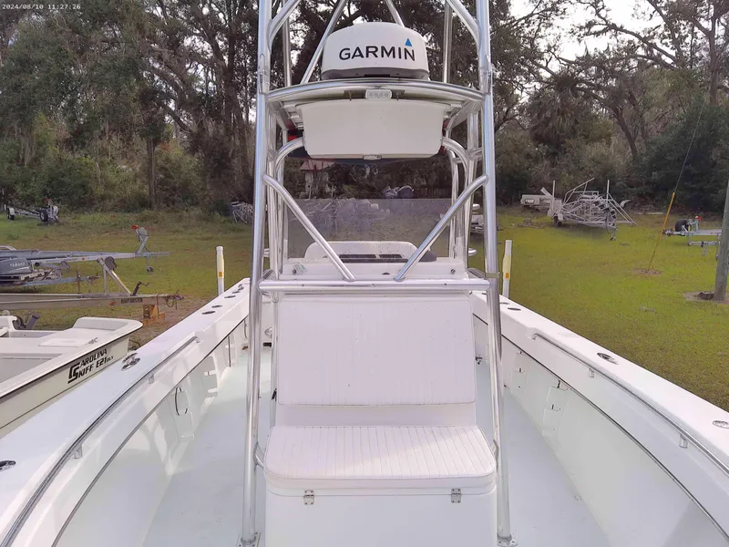 Slide: The Image of 2019 Jones Brothers 26 Cape Fisherman boat with Garmin equipment, parked outdoors. - 5