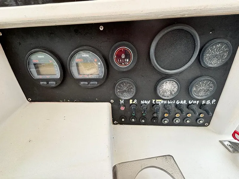 Slide: The Image of Dashboard of a 1985 Grady-White 24 Fisherman boat with gauges and controls. - 10
