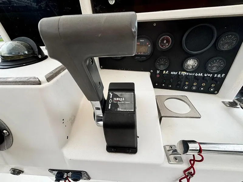 Slide: The Image of Close-up of 1985 Grady-White 24 Fisherman boat controls and dashboard. - 12