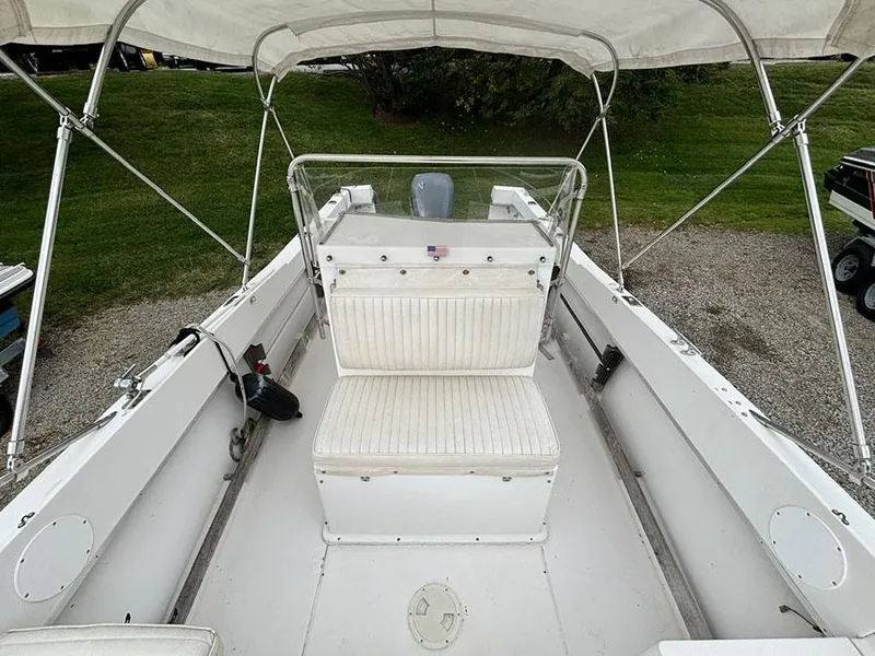 Slide: The Image of 1985 Grady-White 24 Fisherman boat interior with seating and canopy. - 15