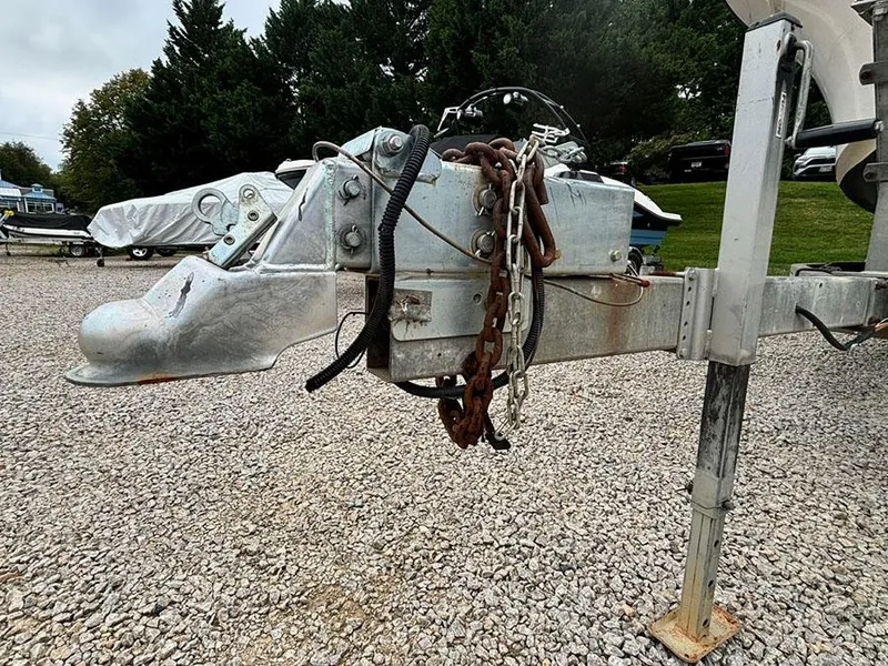 Slide: The Image of Trailer hitch of a 1985 Grady-White 24 Fisherman boat on gravel lot. - 19