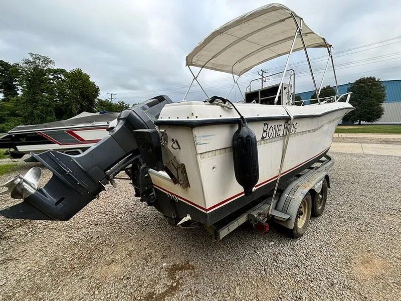 Slide: The Image of 1985 Grady-White 24 Fisherman boat on trailer, parked outdoors. - 4