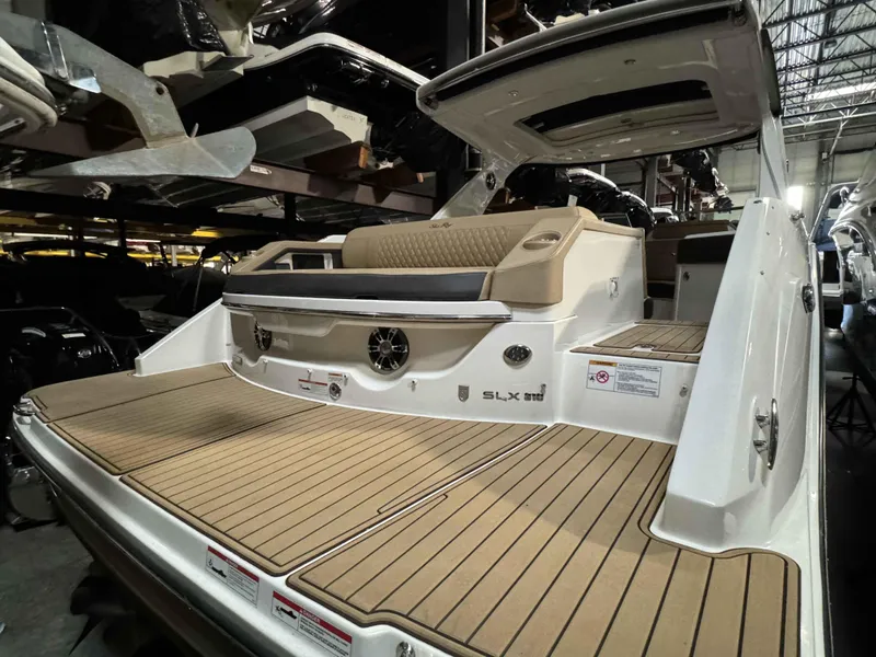Slide: The Image of 2020 Sea Ray 310SLX boat interior with teak flooring and luxurious seating. - 19