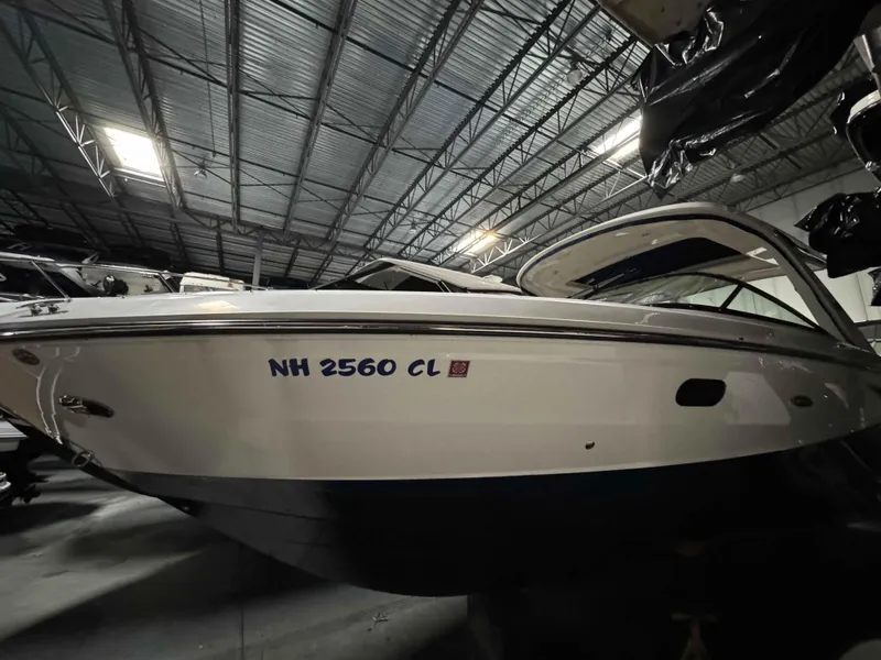 Slide: The Image of 2020 Sea Ray 310SLX boat in storage, side view, registration NH 2560 CL. - 22