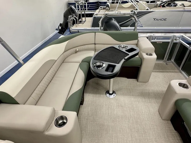 Slide: The Image of Luxurious interior of 2025 Tahoe LTZ 23 Elite pontoon boat with plush seating and table. - 10