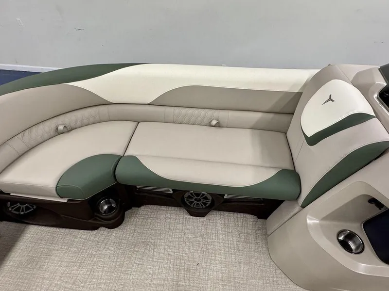 Slide: The Image of 2025 Tahoe LTZ 23 Elite boat interior with green and beige seating. - 18