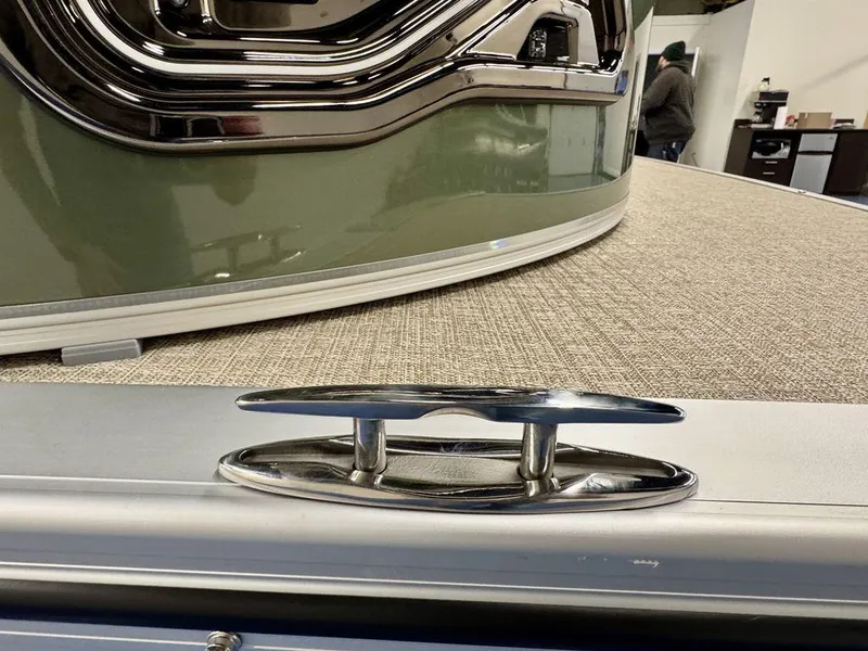 Slide: The Image of 2025 Tahoe LTZ 23 Elite boat detail with chrome cleat and green exterior. - 5