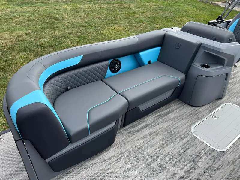 Slide: The Image of 2025 Godfrey Sweetwater 2286 sFLC TRI PWR STR boat seating, gray and blue upholstery. - 10