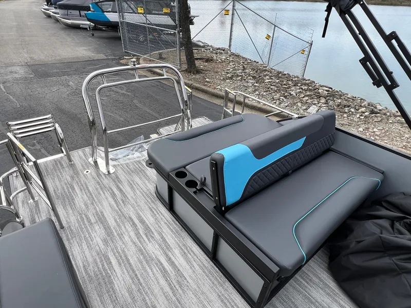 Slide: The Image of 2025 Godfrey Sweetwater 2286 sFLC TRI PWR STR boat interior with sleek seating and modern design. - 16