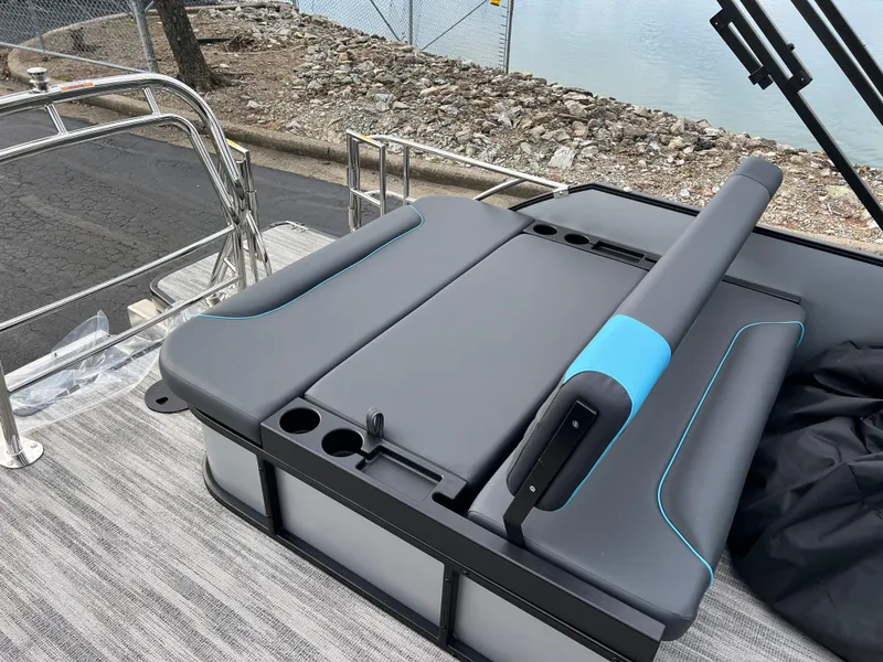 Slide: The Image of 2025 Godfrey Sweetwater 2286 sFLC TRI PWR STR boat seating area with cup holders. - 17