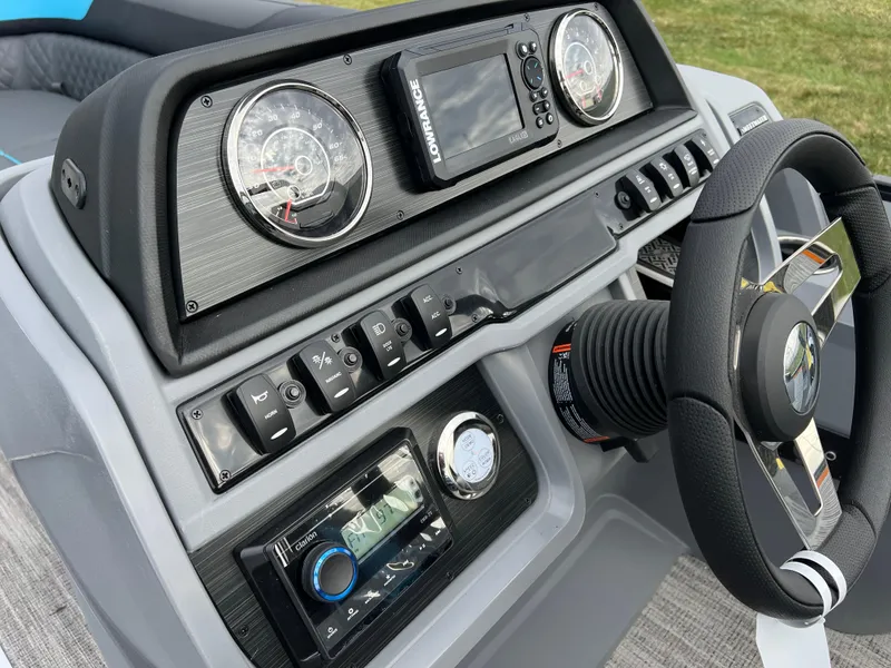 Slide: The Image of Dashboard of 2025 Godfrey Sweetwater 2286 sFLC TRI PWR STR boat with steering wheel and controls. - 21