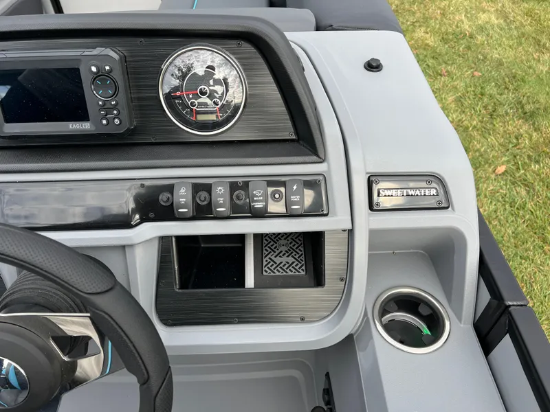 Slide: The Image of Dashboard of 2025 Godfrey Sweetwater 2286 sFLC TRI PWR STR boat with controls and gauges. - 22