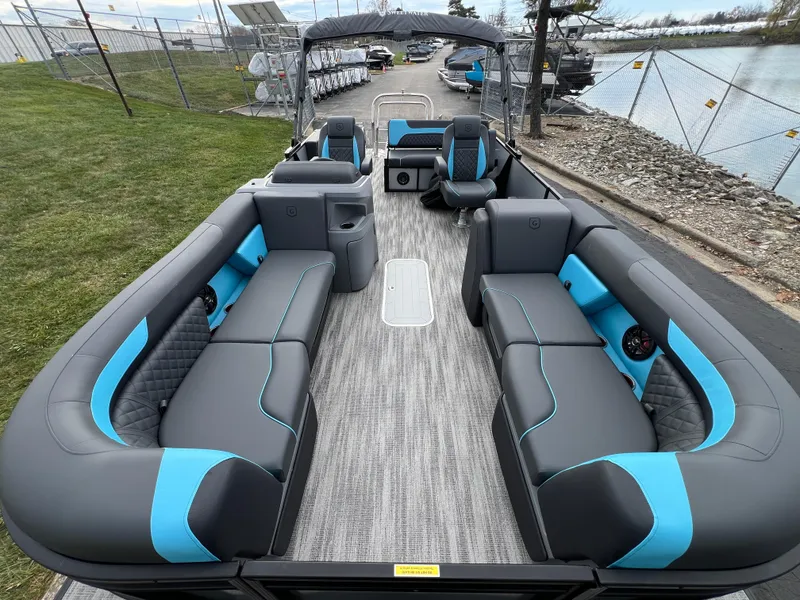 Slide: The Image of 2025 Godfrey Sweetwater 2286 sFLC TRI PWR STR pontoon boat with spacious seating and modern design. - 9