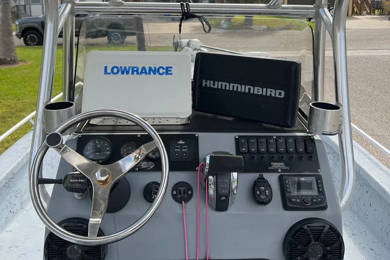 Slide: The Image of 2019 Haynie 25 Magnum boat dashboard with Lowrance and Humminbird electronics. - 3