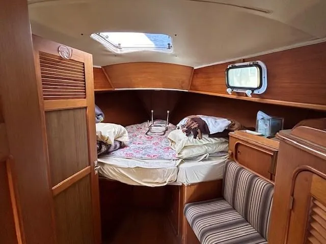 Slide: The Image of Cozy cabin interior of 1980 Irwin 46 Ketch sailboat with bed and seating. - 6