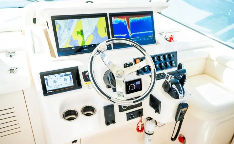 Slide: The Image of 2021 Grady-White Express 330 helm with advanced navigation and control systems. - 13