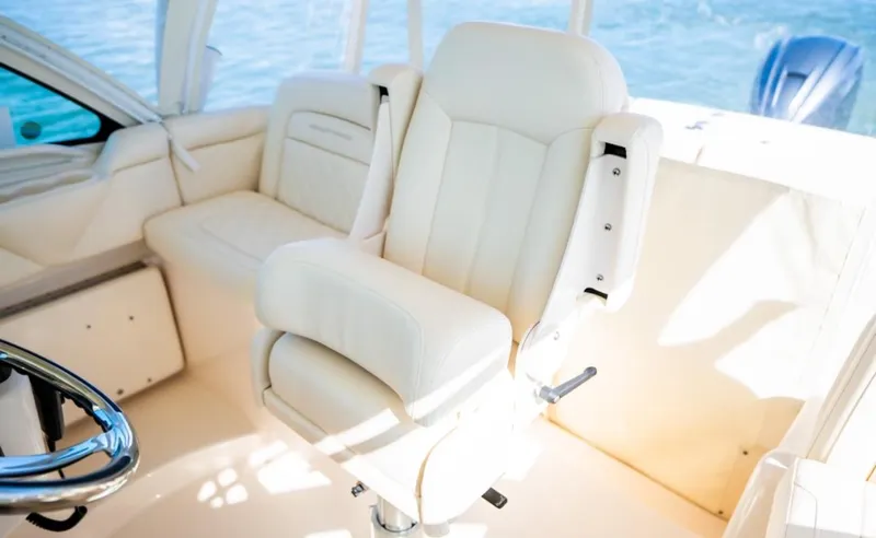 Slide: The Image of Luxurious seating on 2021 Grady-White Express 330 boat interior. - 14