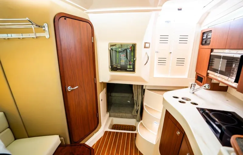 Slide: The Image of Interior of 2021 Grady-White Express 330 boat with modern amenities and wood finishes. - 19