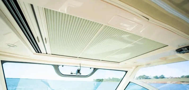Slide: The Image of Interior view of 2021 Grady-White Express 330 boat ceiling and window. - 20
