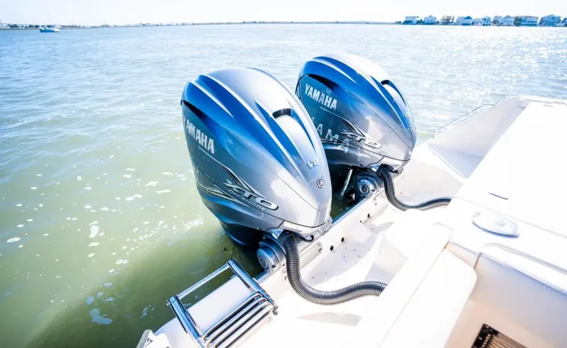 Slide: The Image of 2021 Grady-White Express 330 with twin Yamaha outboard engines on water. - 6