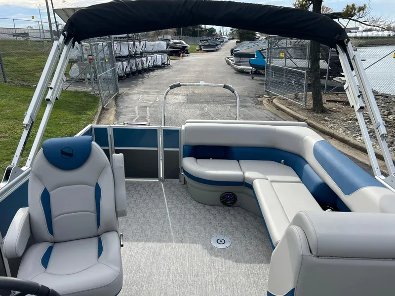 Slide: The Image of 2025 South Bay 222 CR2 LE pontoon boat interior with seating and canopy. - 11