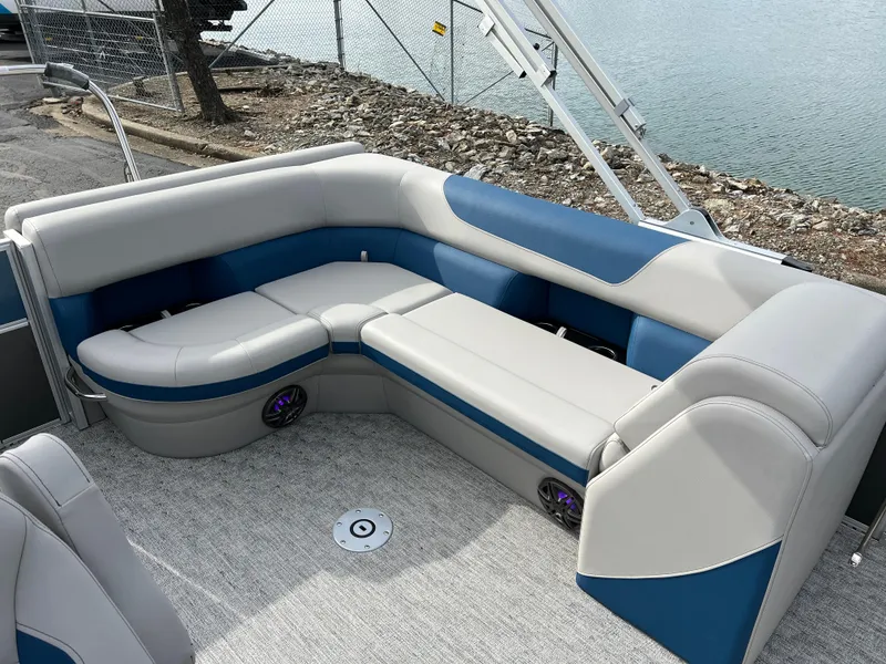 Slide: The Image of 2025 South Bay 222 CR2 LE pontoon boat with blue and gray seating. - 12