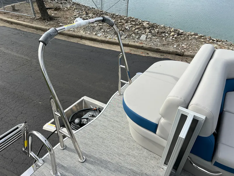 Slide: The Image of 2025 South Bay 222 CR2 LE pontoon boat with seating and safety railings. - 14